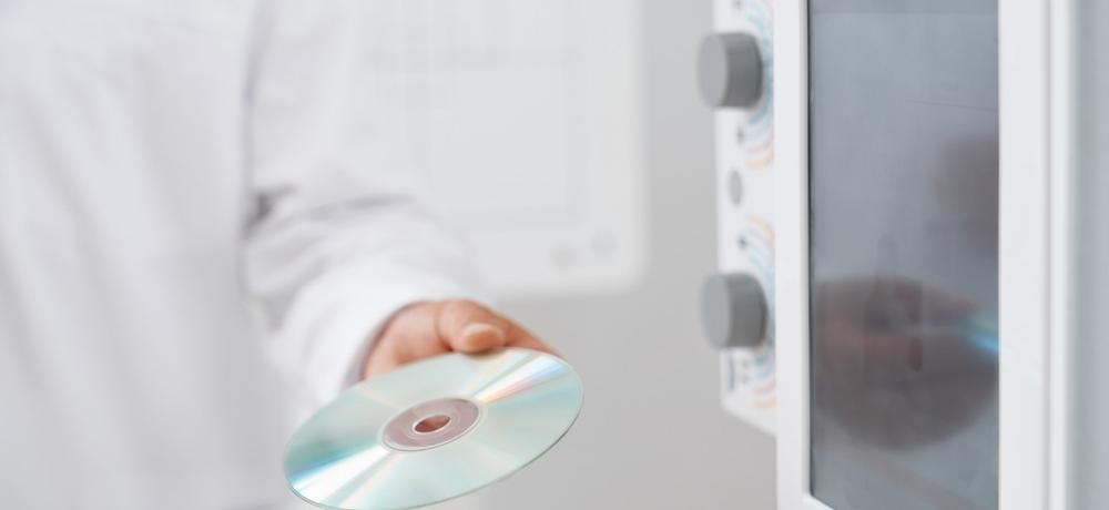 Male doctor holding cd